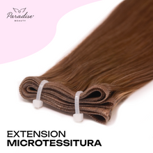 Extension Paradise a microtessitura colore caramello, fascia sottile e invisibile in capelli veri, ideale per vendita extension capelli veri Milano e applicazione naturale con metodo professionale in salone.