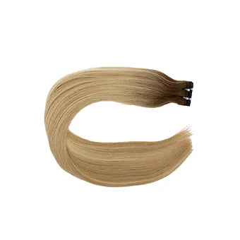 Scopri le Extension Capelli Veri Paradise in colore balayage biondo cenere scuro, ideali per un look luminoso e naturale. 