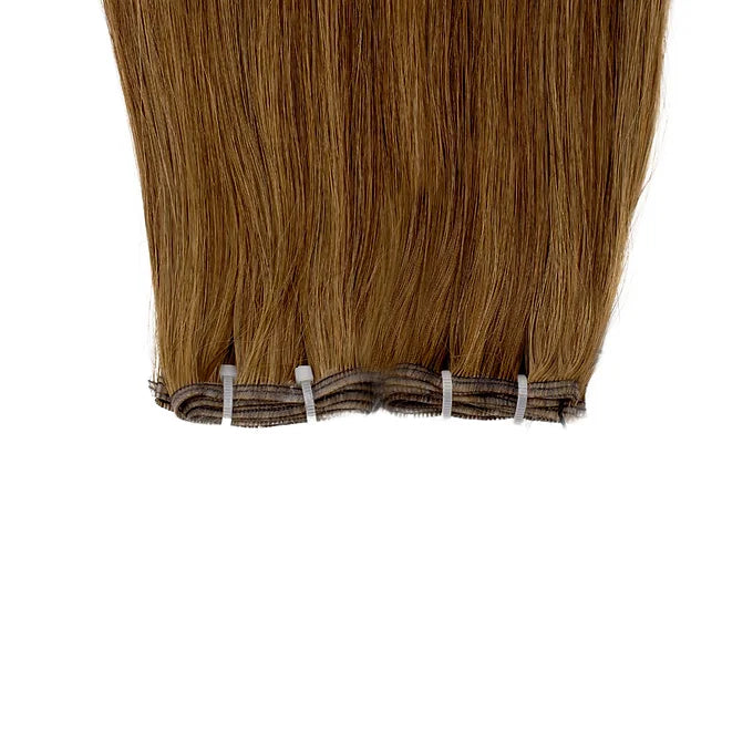 Extension Paradise in castano ramato illuminano il viso con riflessi vivaci, offrendo un look naturale e attraente