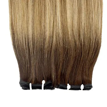 Le Extension Capelli Veri Paradise in balayage biondo scuro offrono una transizione cromatica perfetta
