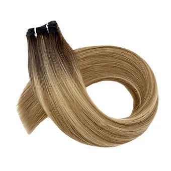 Scopri le Extension Capelli Veri Paradise in balayage biondo scuro, perfette per un look chic e contemporaneo. 